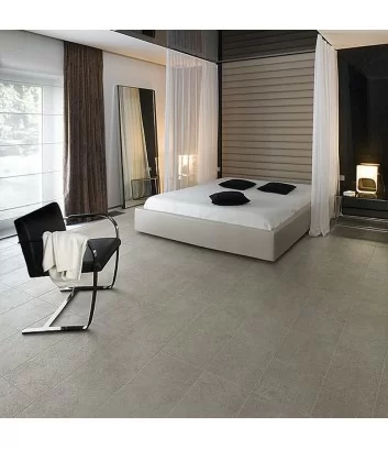 cement effect stoneware tile laid in bedroom floor