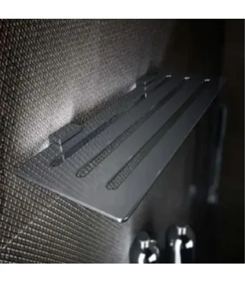 Rectangular chrome shelf with grid inside the shower enclosure
